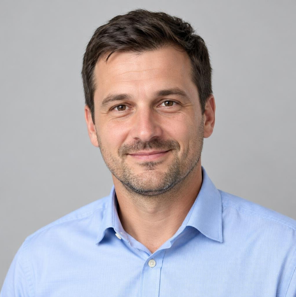 Portrait of a man in a shirt smiling